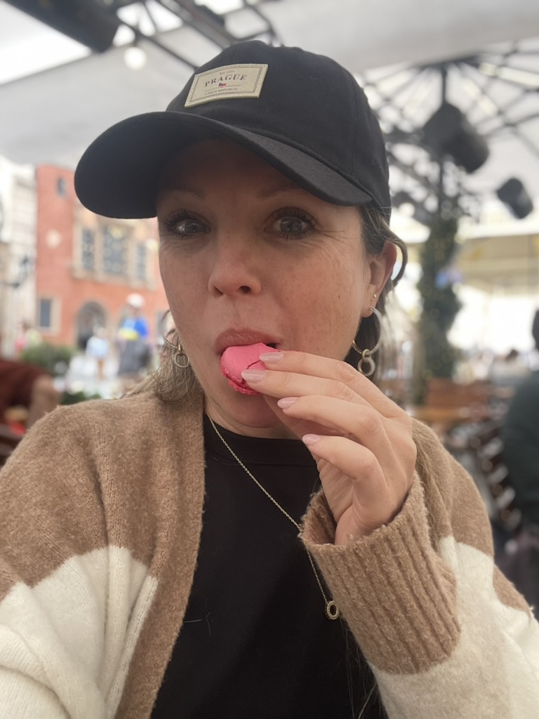 Julie Tague enjoying a pink macaron